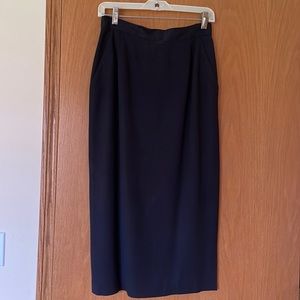 Black midi skirt. Work or evening. Back vent buttons